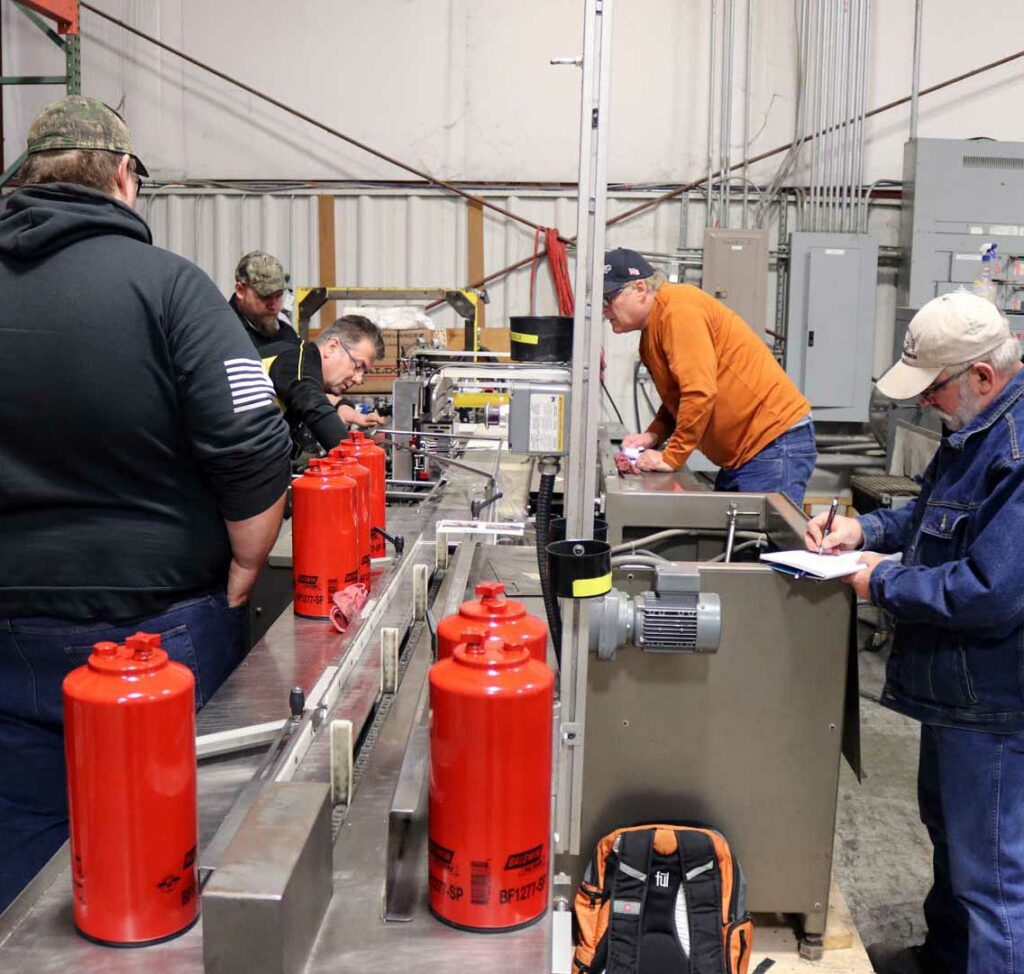 group of 5 employees doing quality inspection