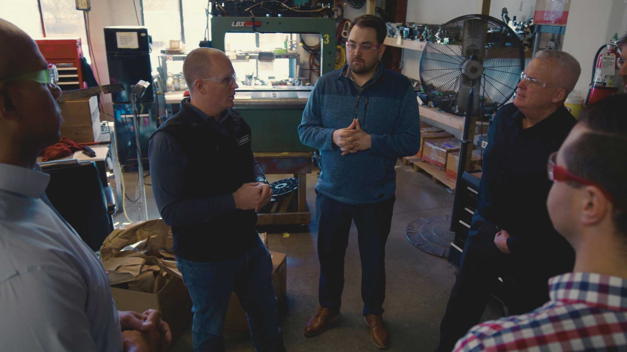 group of male employees talking