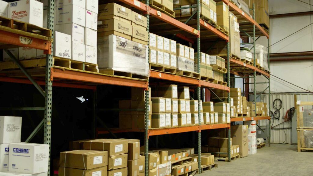 Warehouse wall with boxes on a shelf