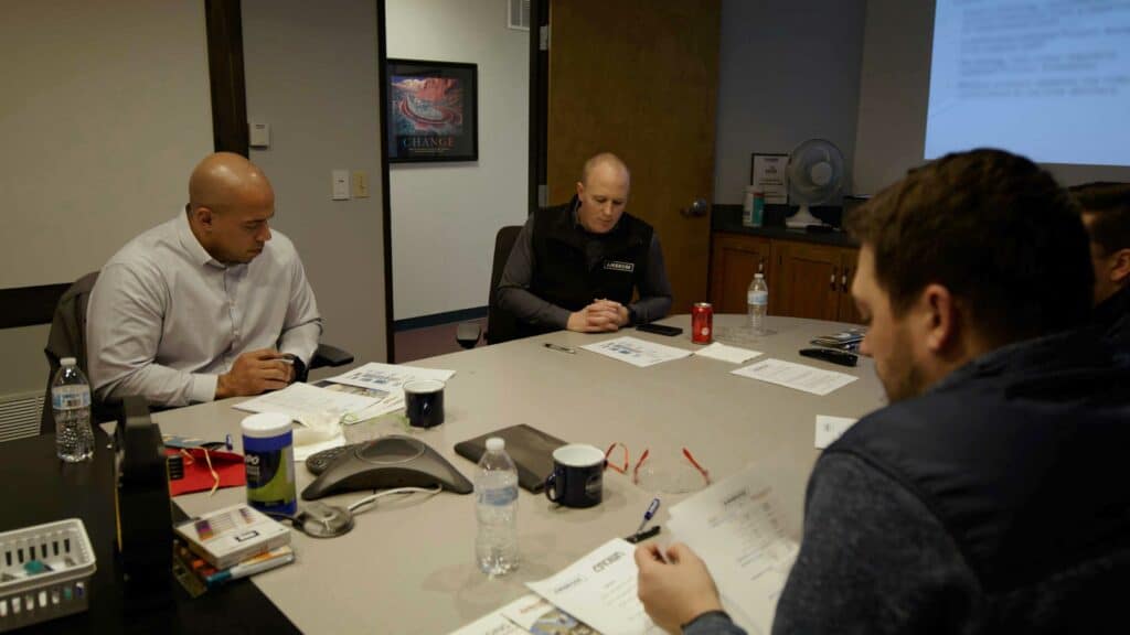 Men going over paperwork in a meeting